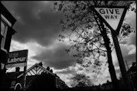 a black and white photo of a street sign